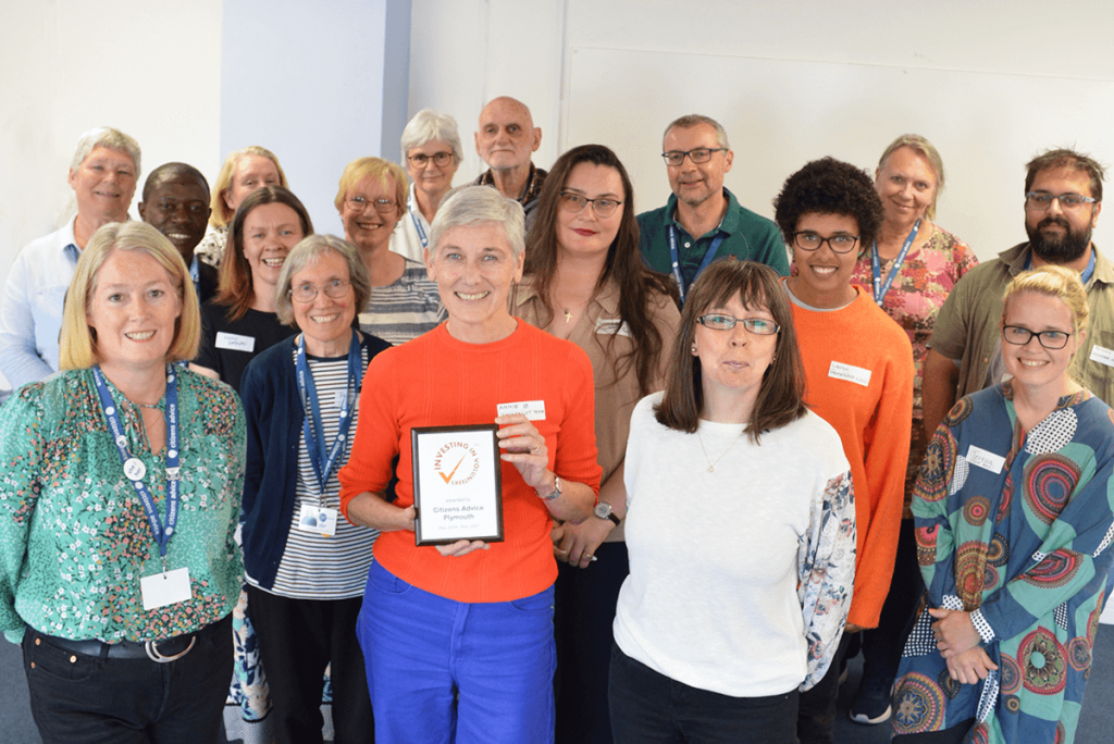 A group of Citizens Advice Plymouth volunteers with the Inversting in Volunteers Award